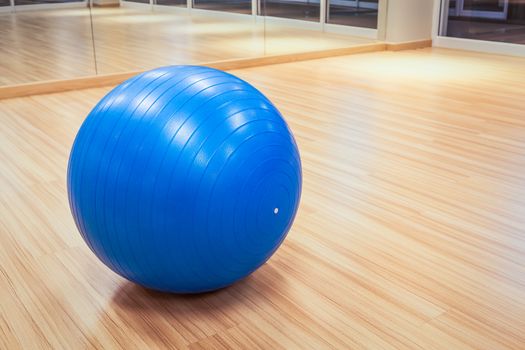 exercise ball for fitness on wooden floor