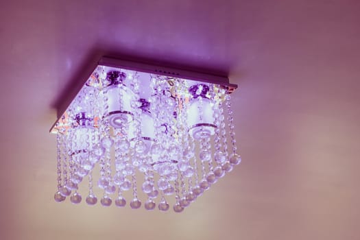 Crystal chandelier on ceiling