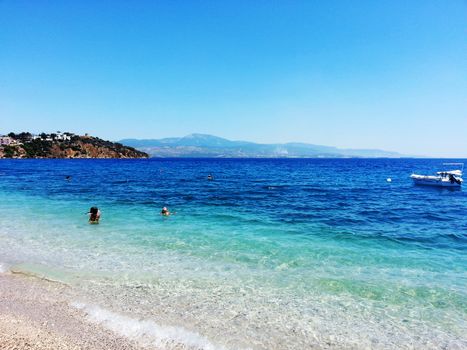 Distant view of children swimming in a Greek Beach.

Picture taken on June 22, 2013.