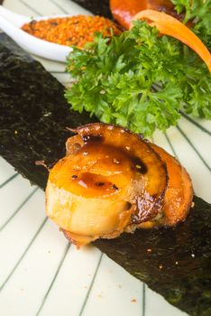 japanese cuisine. grilled shell fish on background