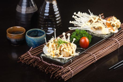 japanese cuisine. grilled shell fish on background