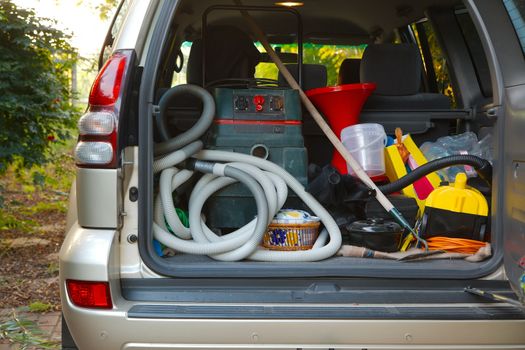 Trunk of a car loaded with equipment