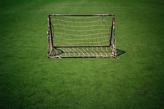 Soccer goal net in the the plastic sports field
