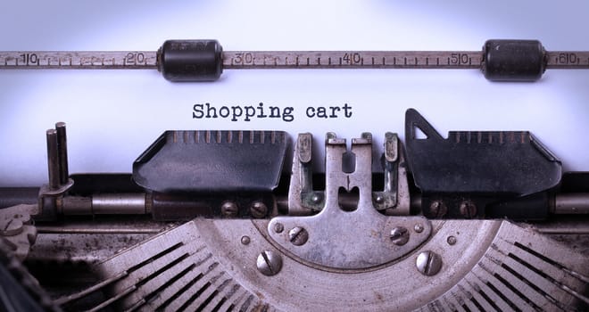 Vintage inscription made by old typewriter, shopping cart
