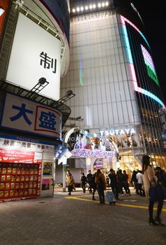 Tokyo, Japan - November 28, 2013: Tourist visit Shibuya District. Shibuya is known as a youth fashion center in Japan as well as being a major nightlife destination on November 28, 2013 in Tokyo, Japan. 