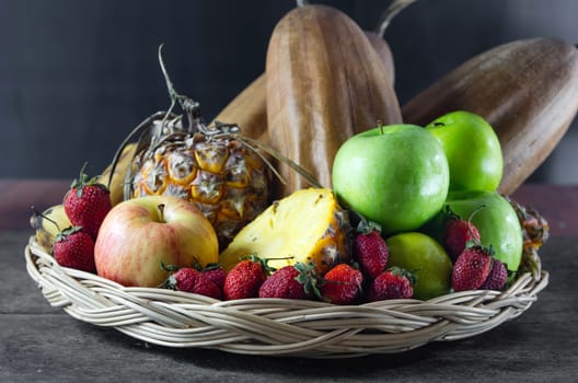 still life of mix fruits ,  apple with strawberry, pineapple and banana