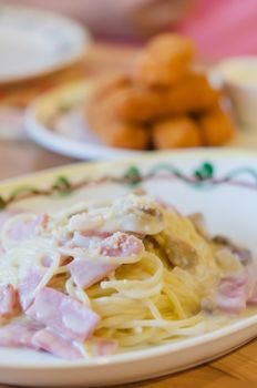 Spaghetti Carbonara with bacon and cheese on dish