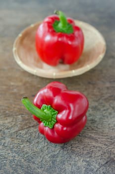 red bell peppers on wooden table