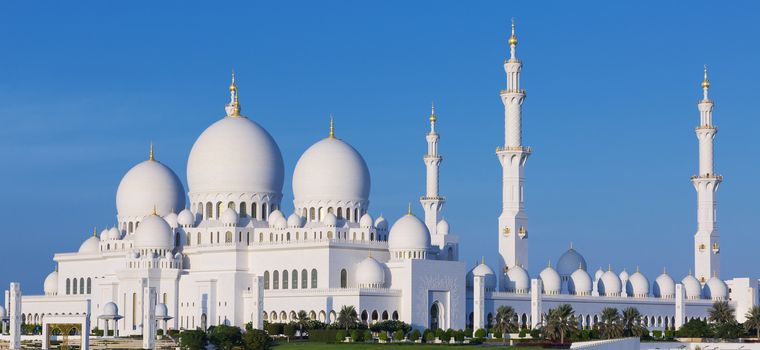 Panoramic view of famous Sheikh Zayed Grand Mosque with blue sky, UAE