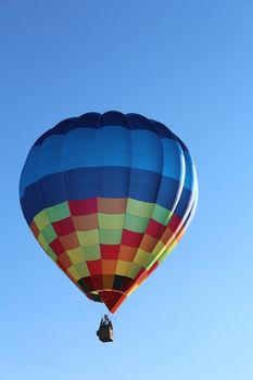 Ferrara, Italia - September 14, 2014: The photo was made at the Ballons Festival at Ferrara on september 14, 2014.A hot air balloon gets up in the sky