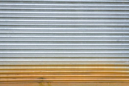 Sheet of corrugated metal with rust as a background