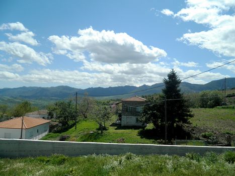 Panoramic view of a green meadow and the blue sky in central Greece,

Picture taken on April 21, 2012