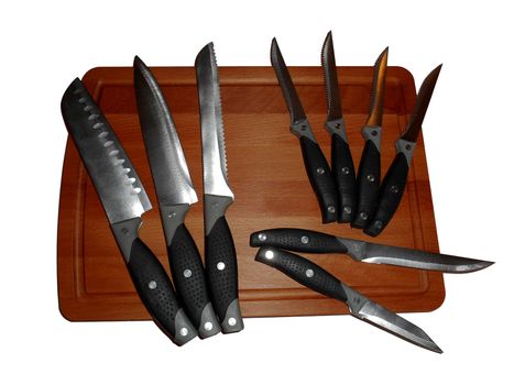 Knives on a cutting board, isolated on white.

Picture taken on November 16, 2014.