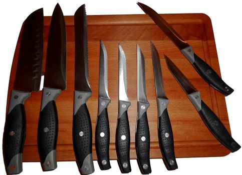 Knives on a cutting board, isolated on white.

Picture taken on November 16, 2014.