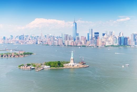 Stunning Manhattan aerial panorama with Statue of Liberty on foreground.