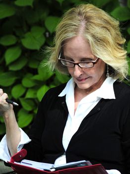 Sexy blond businesswoman expressions outside.