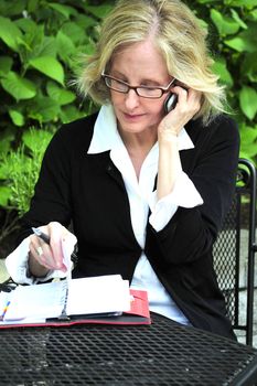 Sexy blond businesswoman expressions outside.