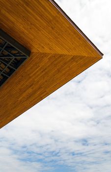 Wooden eaves of the house on a blue sky 