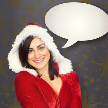 Pretty girl smiling in santa outfit against grey vignette