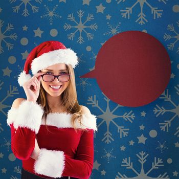 Sexy santa girl wearing spectacles against blue vignette