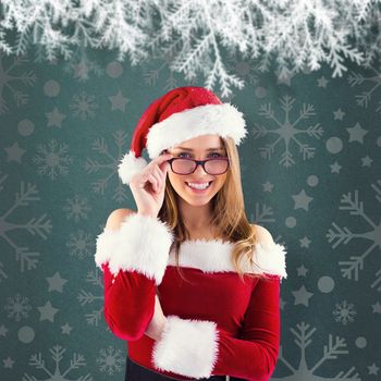 Sexy santa girl wearing spectacles against green vignette