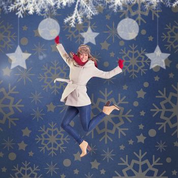 Happy blonde in winter clothes posing against blue vignette