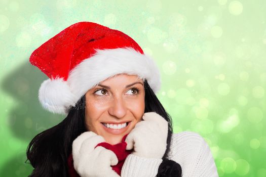 Woman smiling while looking away against green abstract light spot design