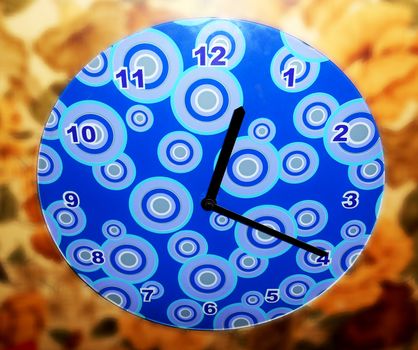 Wall clock on blurred background.

Picture taken on November 9, 2014.