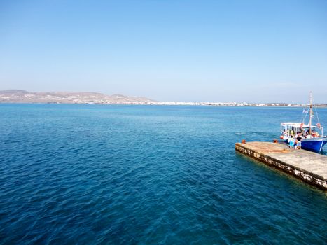Small dock with a daily cruise ship in Paros island, Greece.

Picture taken on August 31, 2011.