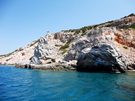 Crystal-clear waters and the rocky shore in Paros Island, Greece.

Picture taken on September 1, 2011.