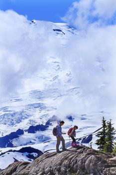 Asian Hikers Hiking Mount Baker Under Clouds from Artist Point  Mount Baker Highway Snow Mountain Washington State Pacific Northwest