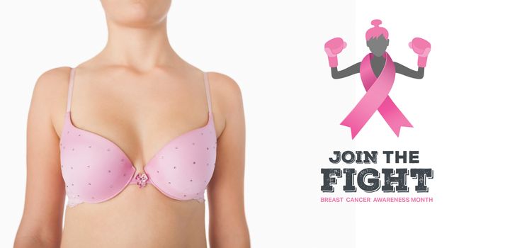 Midsection of woman in pink bra against breast cancer awareness message