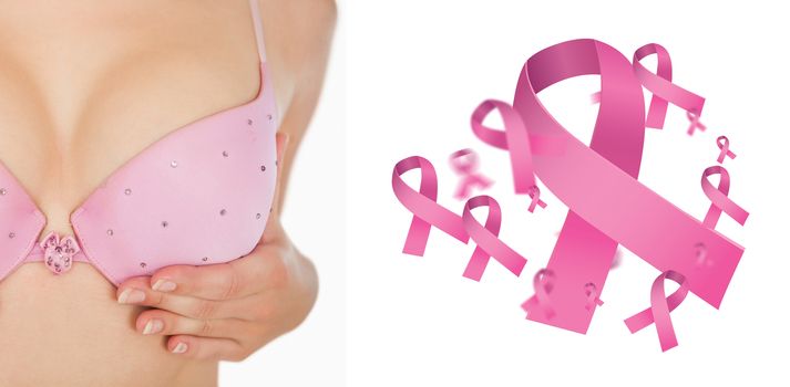 Woman in bra over white background against breast cancer awareness ribbons