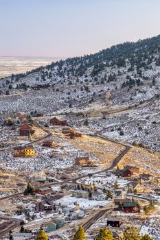 mountain homes at foothills of Rocky Mountains near Fort Collins in northern Colorado, winter sunset scenery