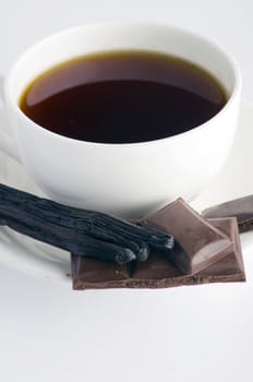 Cup of hot tea with dark chocolate