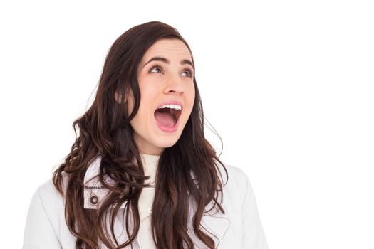 Beauty brown hair in white coat screaming on white background
