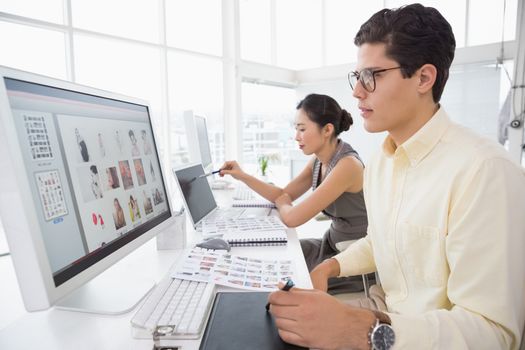 Creative team working at desk in creative office