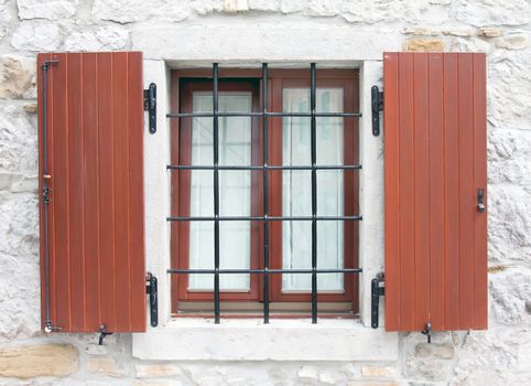 wooden window with metal window grid