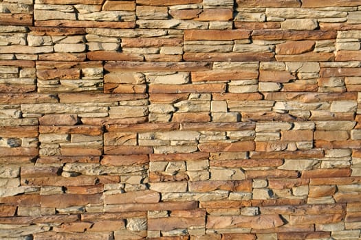 Brown shades color decorative design uneven stone stucco wall                               