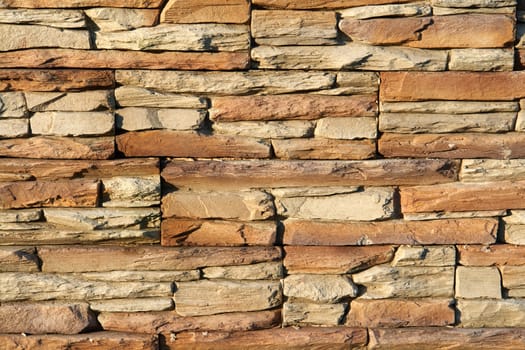 Brown shades color decorative design uneven stone stucco wall                               