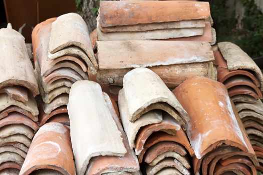 a heap of old abandoned roof tiles