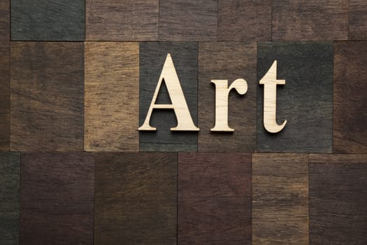 Word ''Art'' on wooden background