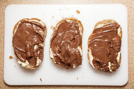 Closeup of a slices of bread with chocolate cream