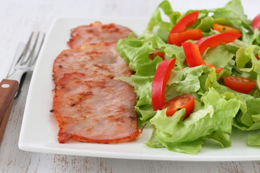 fried meat with salad