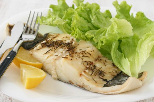 fried fish with salad