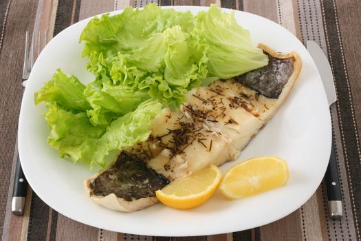 fried fish with salad