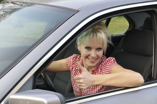 woman driving a gray car