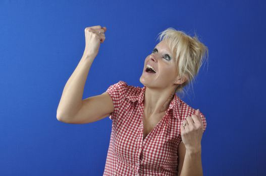 Successful woman with arms up 