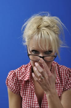 Portrait of a blonde woman wearing glasses
