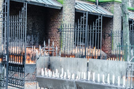 Candles donation, some candles in front of the chapel in Kevelaer commemorating the bereaved. 